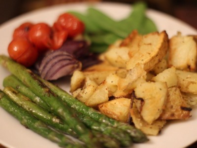 Garlic roasted potatoes, with Pan fried asparagus, cherry tomatoes, red onions and mangetout